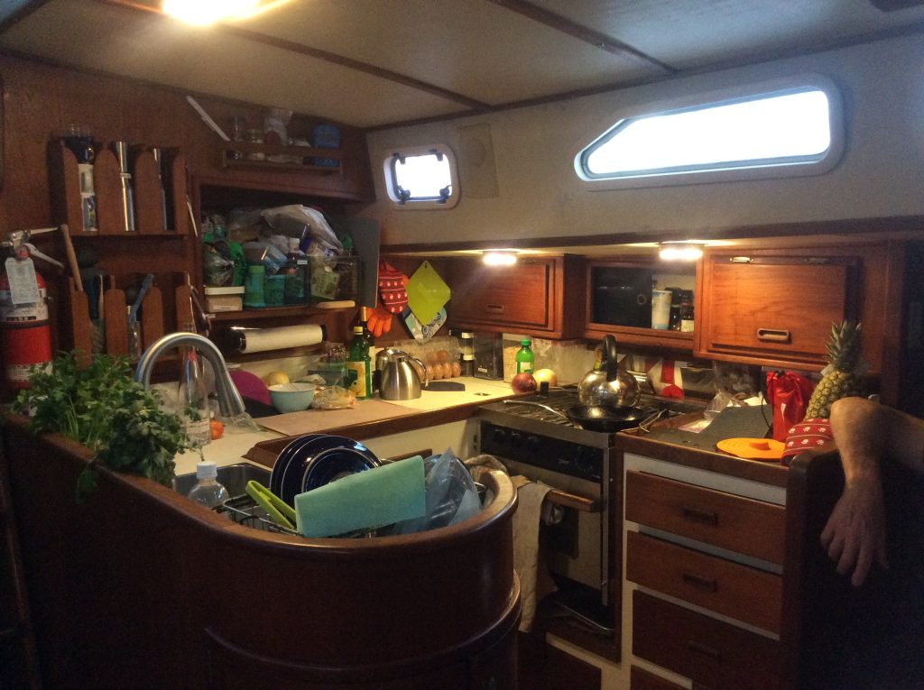 Three Lunasea fixtures in our galley - two small round ones above the lower-ceilinged side counters and a large rectangular unit over the sink and near the companionway