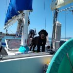 Portugues Water Dog standing behind the traveler in our ketch